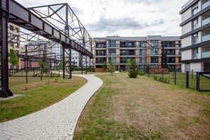 Stroll through the central pathway, surrounded by buildings with a contemporary design.