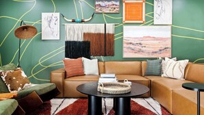 A cozy living room with a sectional sofa, a round coffee table, and a patterned rug. - The Ridge: Family | Pickleball | Pool | Hot Tub (Phoenix)