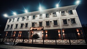 A multi-story building with a sign reading "Bogishamol Hotel". - Bagishamol Hotel (Urgut)