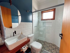 Shower, hair dryer, towels, toilet paper