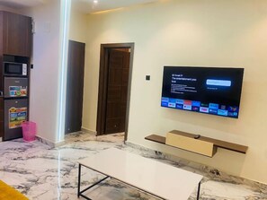 Family Apartment, Balcony, City View | Living area | Flat-screen TV - LV 21 APARTMENT (Lagos)