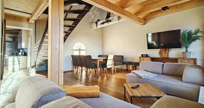 A stylish penthouse flat with a whirlpool bath, a fireplace and a massage chair