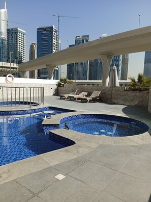Outdoor pool, a heated pool - Spacious 1BR Apartment in Dubai Marina-Opp. Marina Walk-5 Mins Walk To JBR Beach (Dubai)