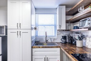 Fridge, microwave, coffee/tea maker, toaster