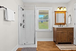 Shower, hair dryer, towels, shampoo