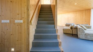 A wooden interior with a staircase leading to a living area. - 3 bedroom lovely home in Warten (Warten)