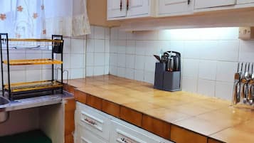Classic Apartment | Private kitchen | Fridge, microwave, dining tables