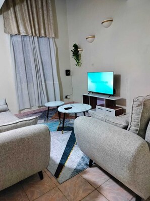 Classic Apartment | Living area | 24-inch Smart TV with digital channels