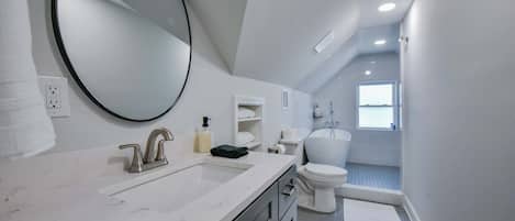 Shower, hair dryer, towels, shampoo