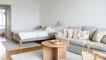 Apartment, Sea View | Living area | Flat-screen TV