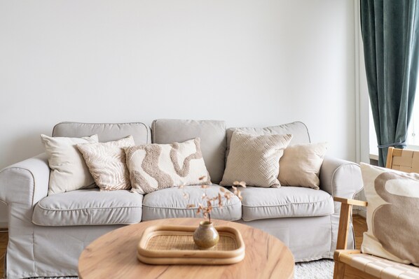 Apartment, Sea View | Living area | Flat-screen TV