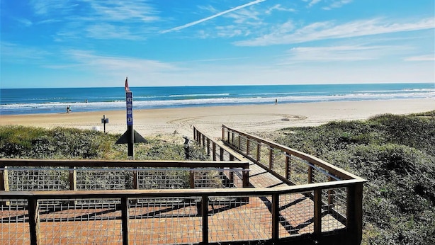A beach view with a wooden walkway leading to a viewing platform. - Walk to Beach! Condo w/ Pool Access in Texas (South Padre Island)