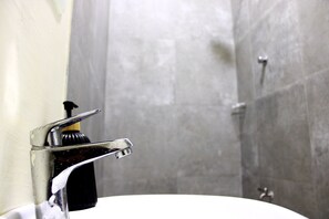 Shower, hair dryer, towels, toilet paper