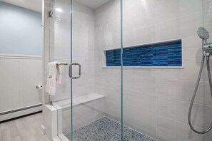 Shower, hair dryer, towels, shampoo