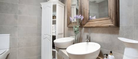 Shower, hair dryer, towels, toilet paper