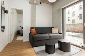 Design Apartment, Non Smoking, Kitchen | Living area | 160-cm TV with digital channels, Netflix, heated floors