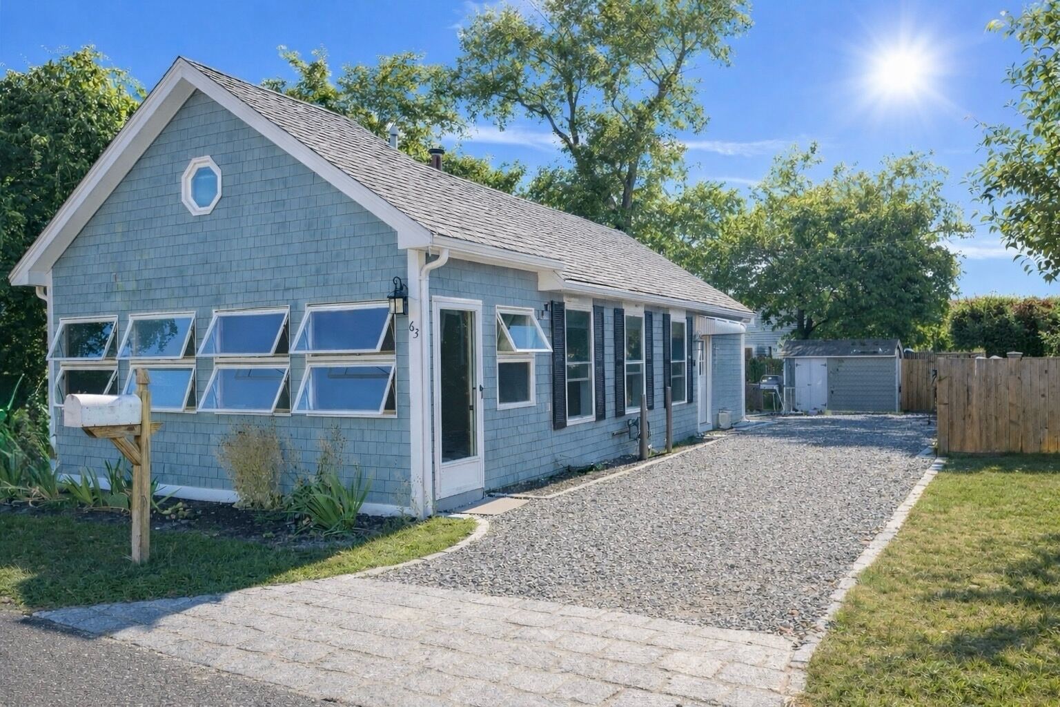 Front of the cottage and driveway parking for up to 4 cars