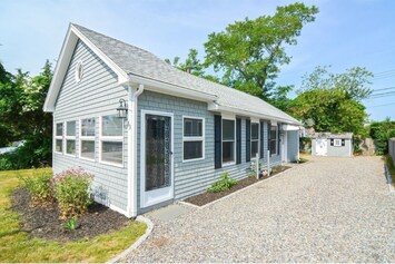 Front of the cottage and driveway parking for up to 4 cars