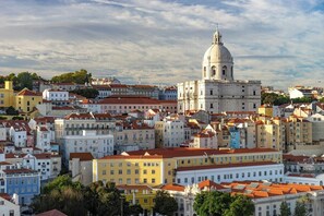 A densely packed urban area with historic buildings and a prominent dome structure. - Lisbon Viewpoint Retreat (Lisbon)