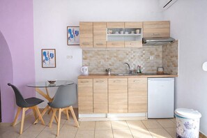 Fridge, highchair, cookware/dishes/utensils