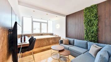 Grand Apartment with SeaView and hot tub | Living area | Flat-screen TV