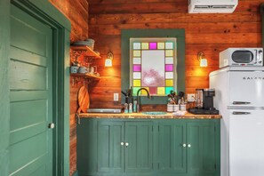 Fridge, microwave, stovetop, coffee/tea maker