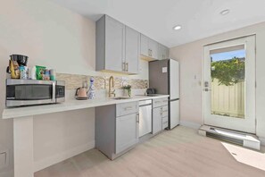 Fridge, coffee/tea maker, cookware/dishes/utensils