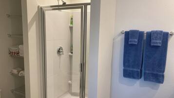 Shower, hair dryer, towels, soap
