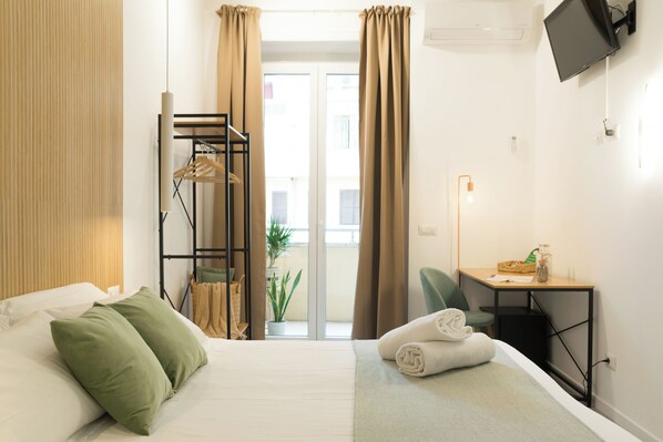 Family Room | Down comforters, desk, laptop workspace, iron/ironing board