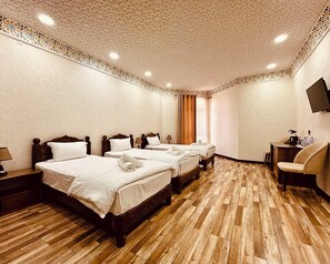 Standard Triple Room, Courtyard View | In-room safe, desk, laptop workspace, soundproofing - Ayvan Plaza (Bukhara)