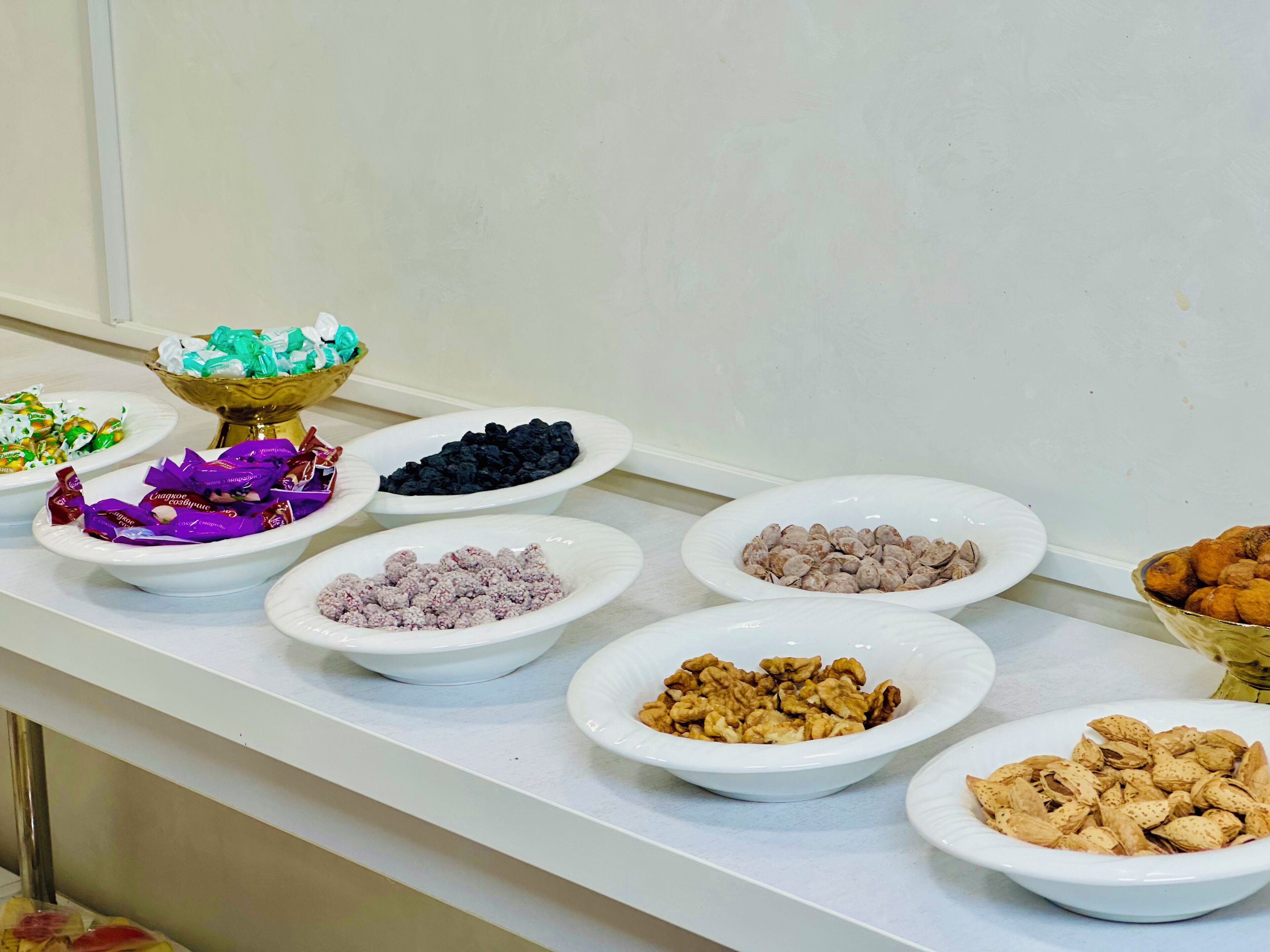 A buffet table with various food items.