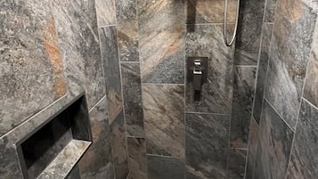 Shower, hair dryer, towels, toilet paper