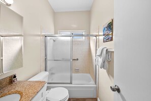 Shower, hair dryer, towels