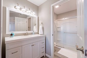 Shower, hair dryer, towels, shampoo