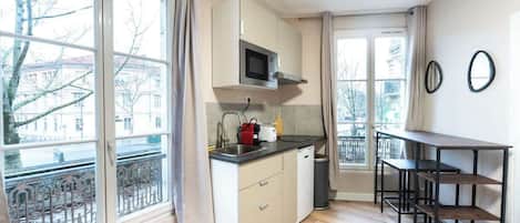 Fridge, microwave, stovetop, coffee/tea maker