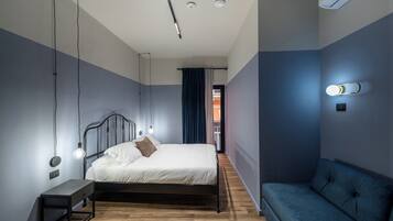 Deluxe Triple Room, Balcony | In-room safe, desk, laptop workspace, blackout drapes
