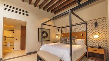 A modern bedroom with a four-poster bed, a wooden bench, and a nightstand with a lamp.