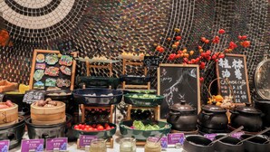 A variety of food items and condiments displayed on a counter with a decorative tiled wall in the background. - Li River Purejoy Hotel Guilin - Elephant Trunk Hill - Two Rivers and Four Lakes Branch (Guilin)