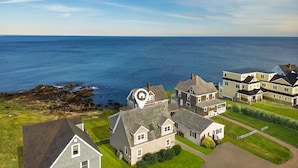A coastal residential area with houses, a clear view of the sea, and a rocky shoreline. - Oceanfront Views, 2 Living Rooms, Walk to Beach (York)