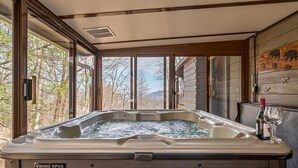 A hot tub with a wooden interior and a view of trees and mountains outside. - Ellijay Mountain View, Pets, Pool, Firepit, HotTub, Gameroom, Grill & Fireplace (Ellijay)