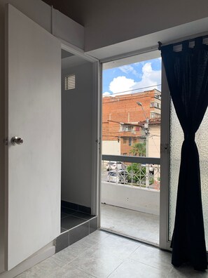 Quadruple Room, Balcony, City View | Iron/ironing board, free WiFi - Hostal CasaBlanca in Laureles Medellin (Medellín)