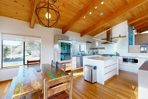 Enjoy cooking in this well-lit kitchen with ample counter space and a large island.