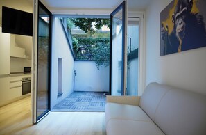 Apartamento ejecutivo | Zona de estar | Una televisión de pantalla plana