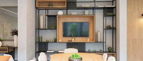 A modern dining area with a wooden table, white chairs, and a central decorative bowl.