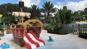 A pirate-themed play area with a slide and a ship structure.