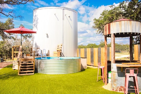Outdoor spa tub. Texas Hill Country views at The Oval House on the Owl Spring Ranch near Boerne