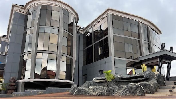 A modern building with a curved facade and large windows. - Infinite Luxury Hotels and Suites (Enugu)