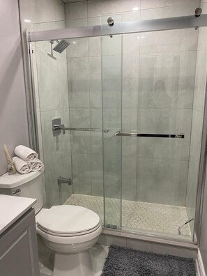 Shower, hair dryer, towels, soap