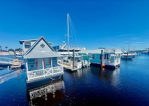 A marina with floating houses, docks, and boats. - Famous Houseboat (Sanford)