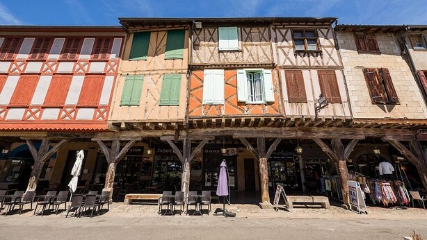 A row of traditional half-timbered buildings with shops on the ground floor. - HOUSE WITH A VIEW OF THE PYRENEES OF THE ARIEGE AT TREZIERS NEAR MIREPOIX (Tréziers)
